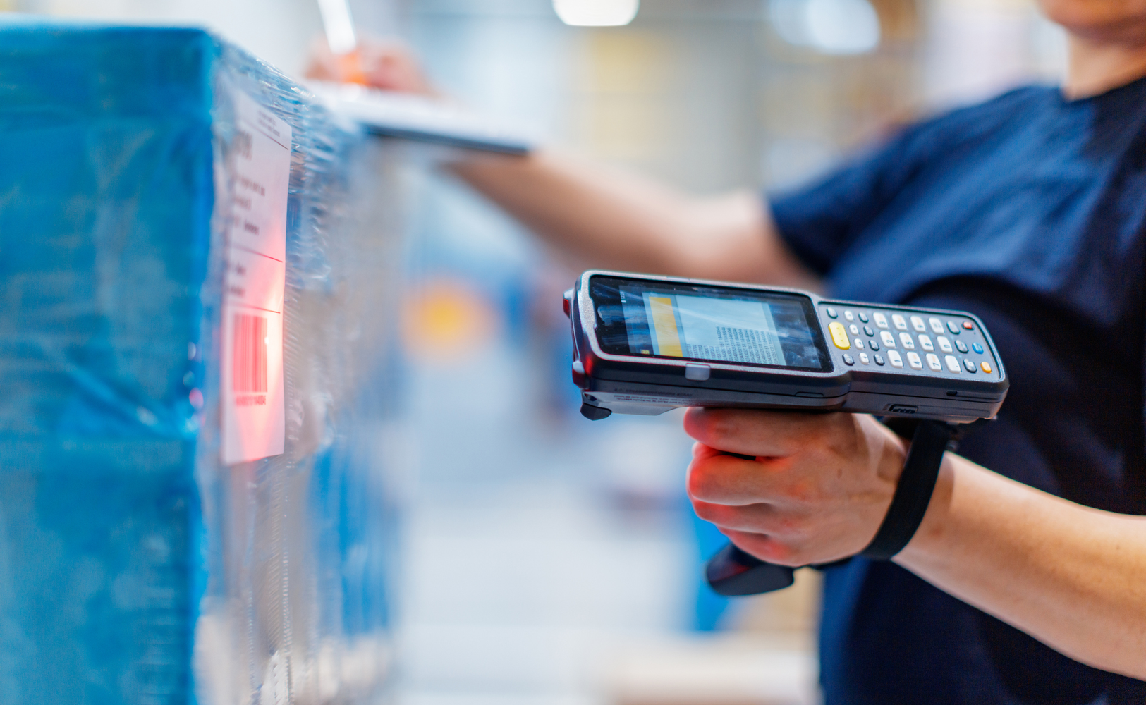 Warehouse Worker Scanning Package