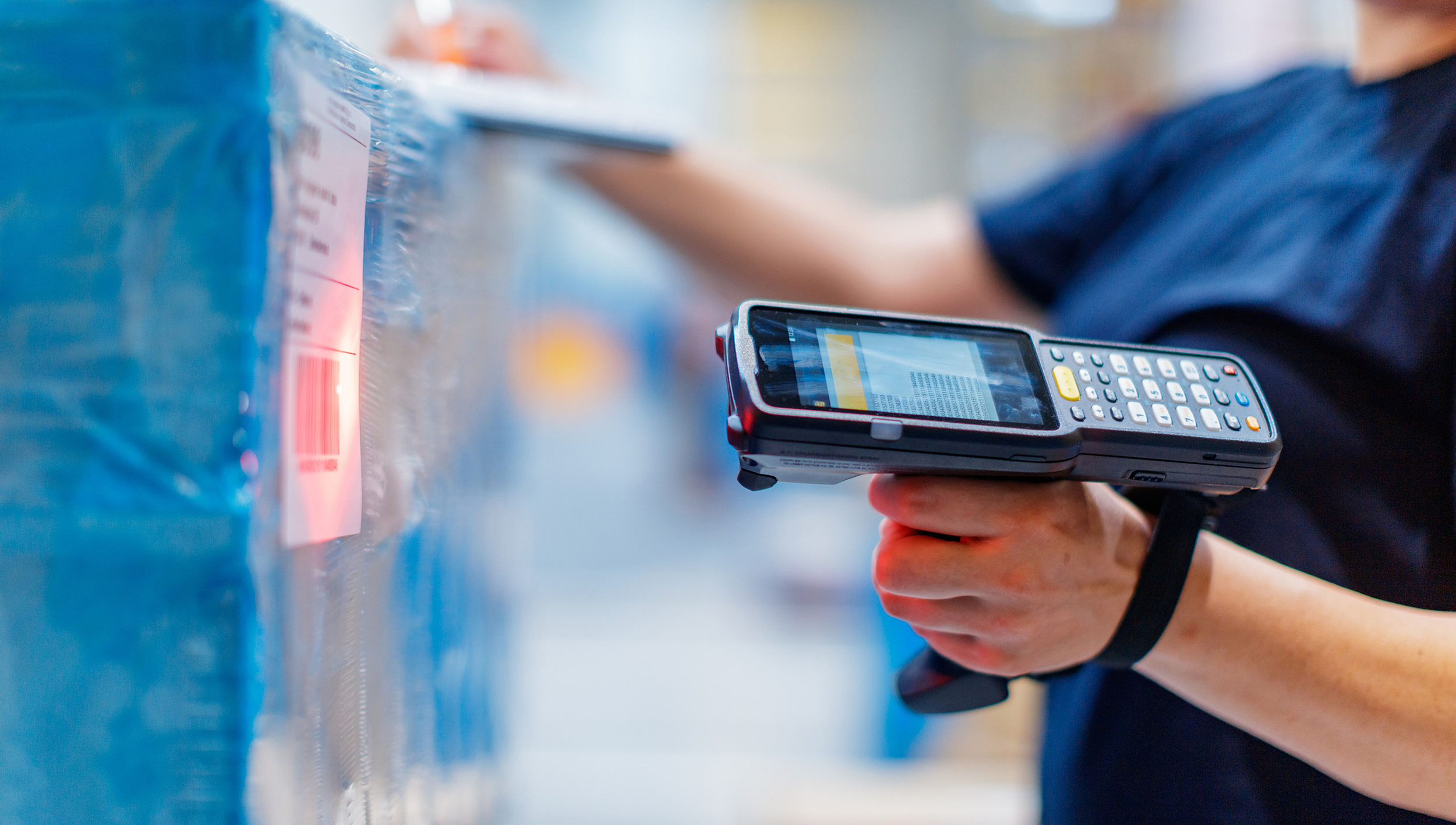 Warehouse Worker Scanning Package