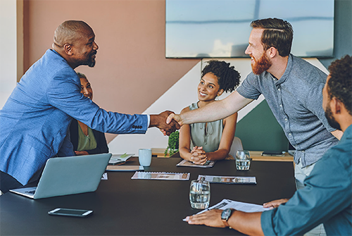 partners-shaking-hands-at-merger-or-acquisition